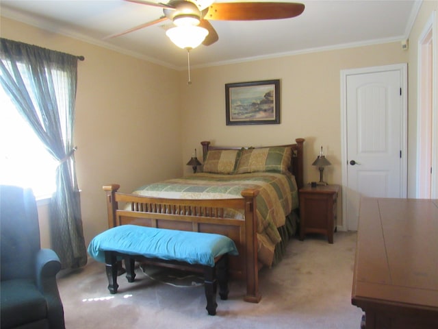 bedroom featuring ceiling fan, ornamental molding, and light carpet