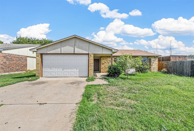 ranch-style home featuring a garage and a front yard