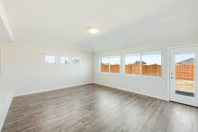 spare room featuring hardwood / wood-style floors