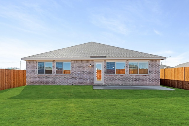 back of house featuring a yard and a patio area