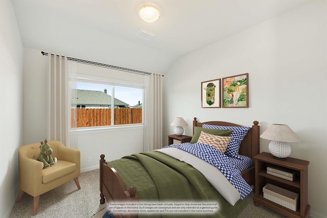 carpeted bedroom featuring vaulted ceiling