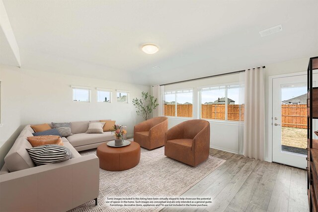 living room with light hardwood / wood-style floors