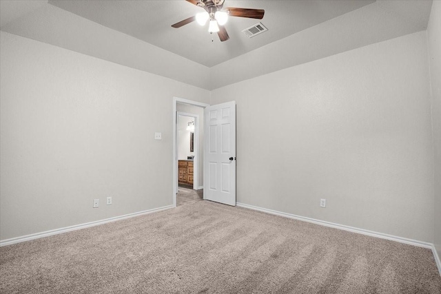 carpeted empty room featuring ceiling fan