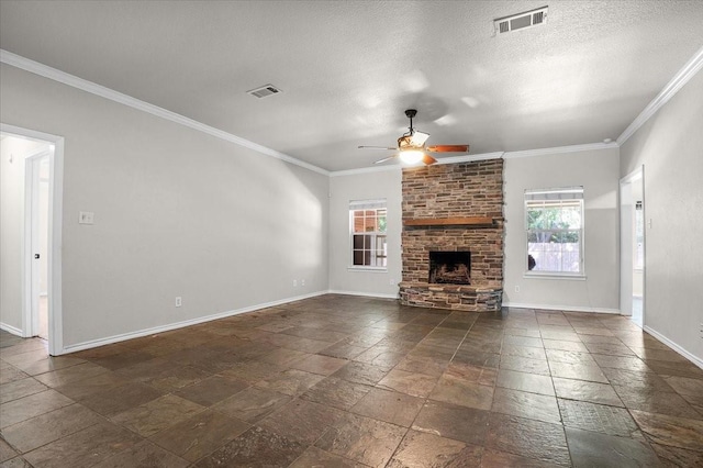 unfurnished living room with a textured ceiling, a fireplace, ornamental molding, and ceiling fan