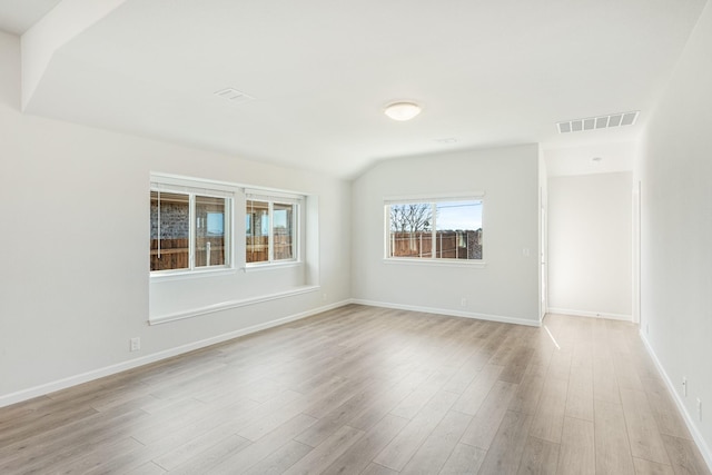 unfurnished room with light wood-type flooring