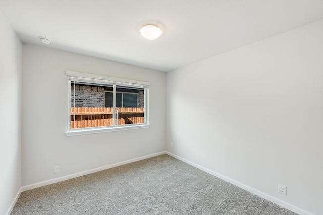 unfurnished room with carpet floors