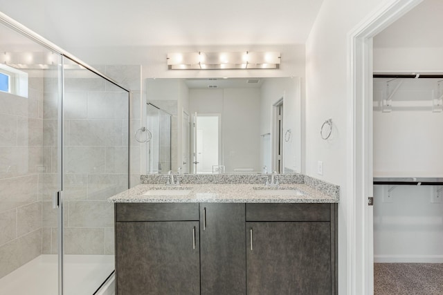 bathroom with vanity and an enclosed shower