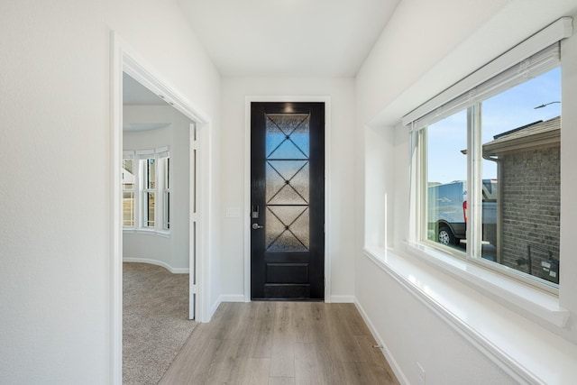 foyer entrance with light wood-type flooring