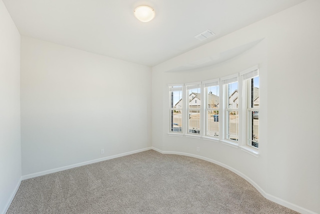 empty room featuring carpet flooring