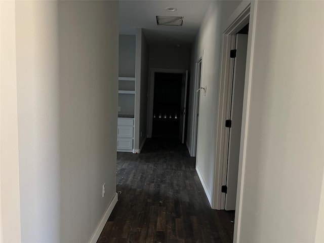 corridor with dark wood-type flooring