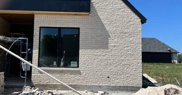 view of property exterior featuring french doors