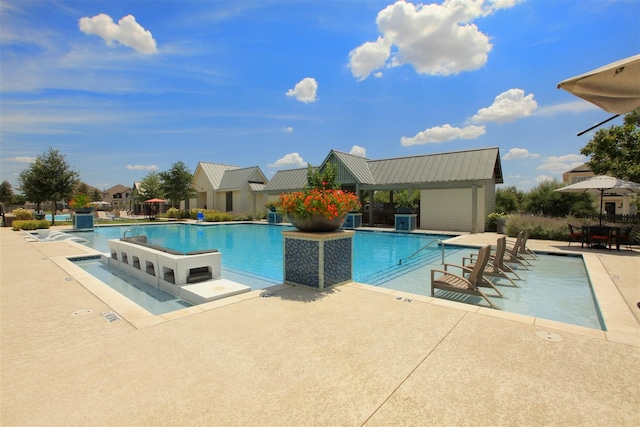 view of swimming pool featuring a patio