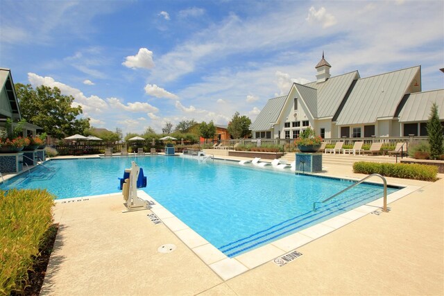 view of swimming pool featuring a patio