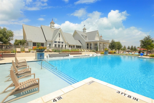 view of pool featuring a patio