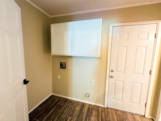 washroom featuring cabinets, hookup for a washing machine, wood-type flooring, and crown molding