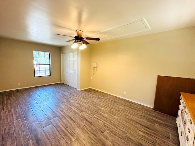 interior space featuring ceiling fan, wood-type flooring, and a closet