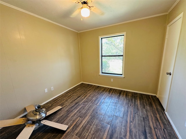 unfurnished room featuring dark hardwood / wood-style flooring, ornamental molding, and ceiling fan