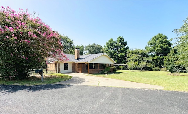 ranch-style home with a front yard