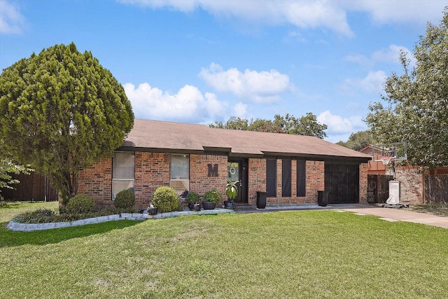 ranch-style house with brick siding, a front lawn, and an attached garage