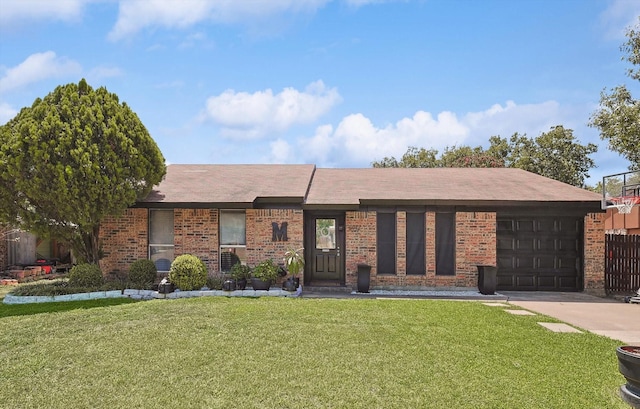 single story home featuring a front lawn and a garage