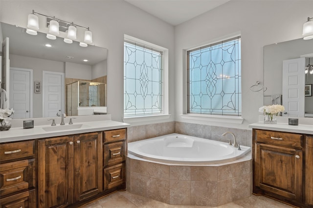 bathroom featuring vanity, separate shower and tub, and tile patterned floors