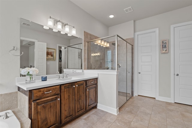 bathroom with vanity, tile patterned floors, and an enclosed shower