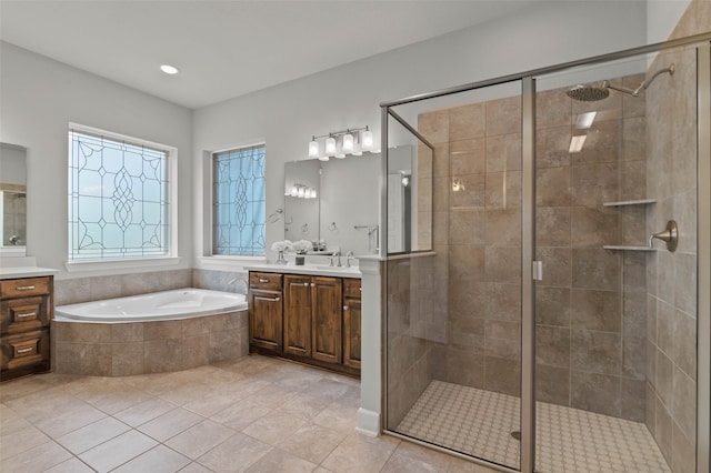 bathroom featuring tile patterned flooring, vanity, and independent shower and bath