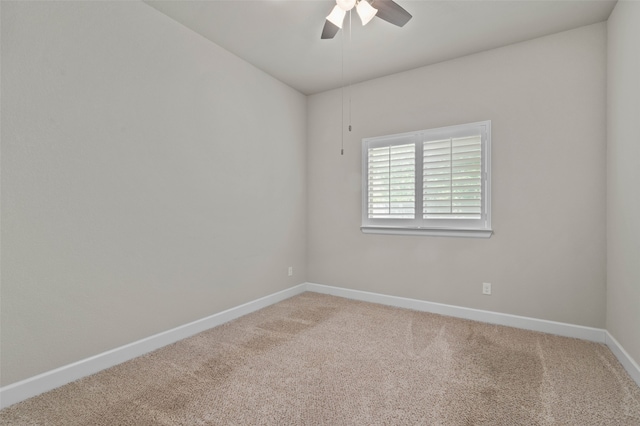 unfurnished room with ceiling fan and carpet floors