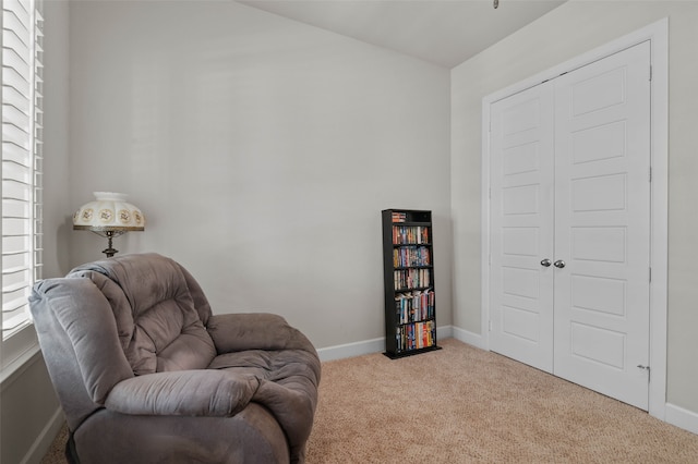 living area featuring light colored carpet