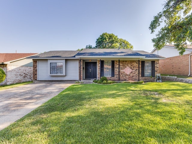 ranch-style home with a front lawn