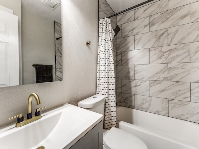 full bathroom featuring shower / bath combo with shower curtain, toilet, and vanity