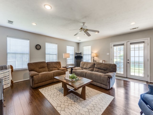 living room featuring dark wood-type flooring, ceiling fan, and french doors