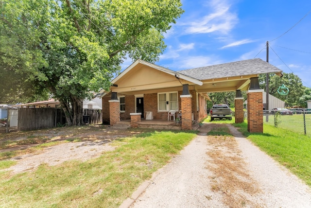 view of front of house with a front lawn and covered porch