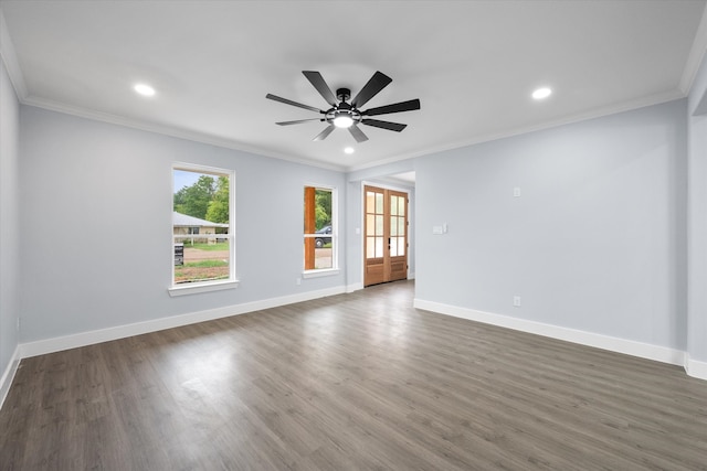 spare room with ceiling fan, dark hardwood / wood-style floors, and crown molding