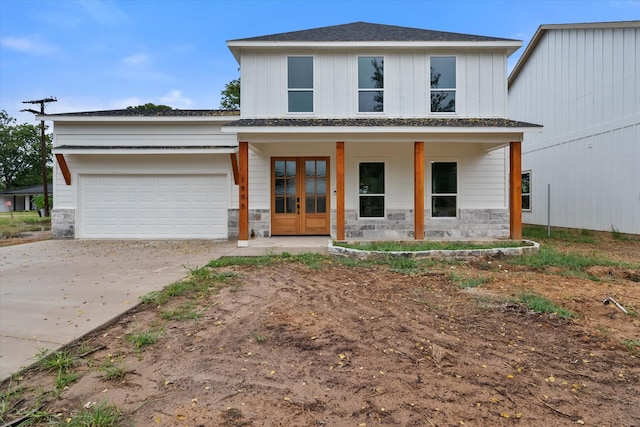 view of front of house featuring a garage and a porch