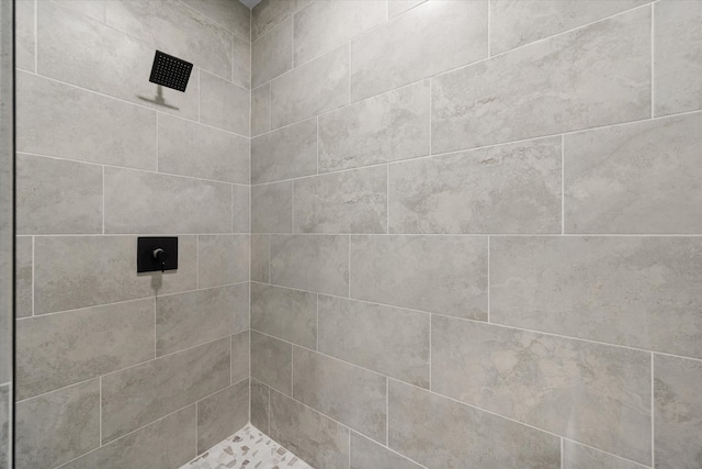 bathroom with tiled shower