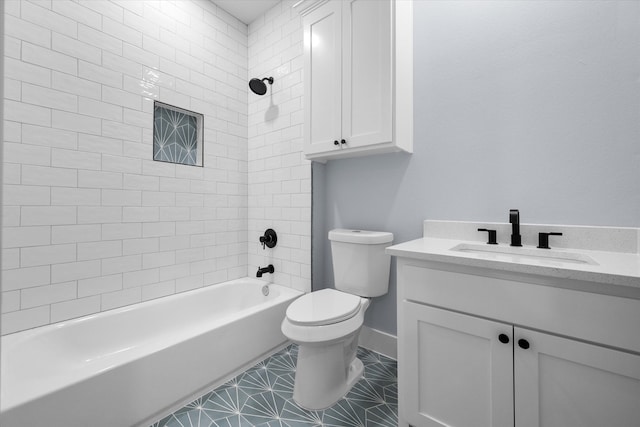 full bathroom with tiled shower / bath, vanity, and toilet