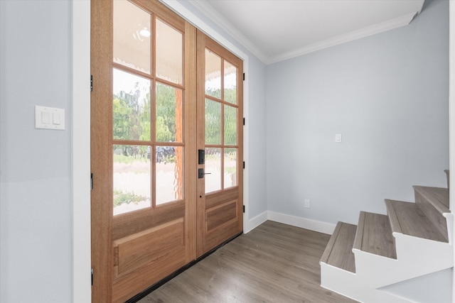 doorway to outside with crown molding, hardwood / wood-style floors, and plenty of natural light