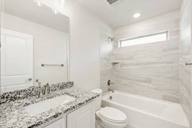 kitchen featuring a towering ceiling, built in microwave, white cabinetry, custom exhaust hood, and stainless steel oven