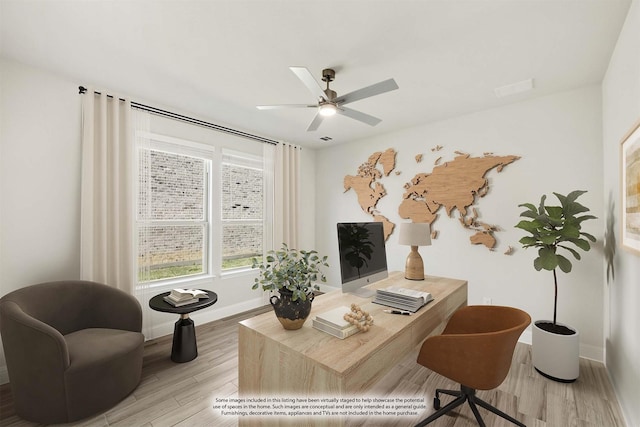 office area featuring light hardwood / wood-style flooring and ceiling fan