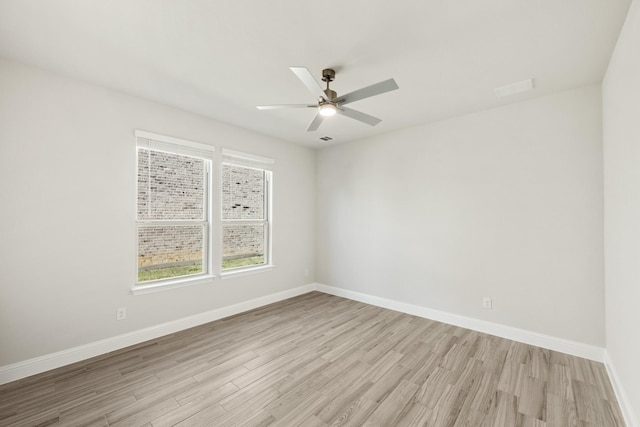 empty room with ceiling fan and light wood-type flooring