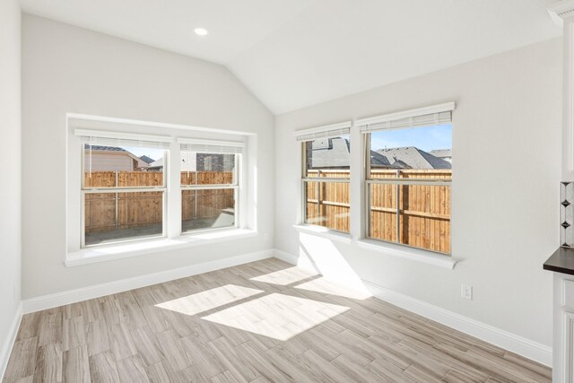 spare room with lofted ceiling, carpet flooring, and ceiling fan