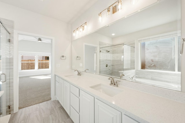 bathroom with vanity and a shower with shower door