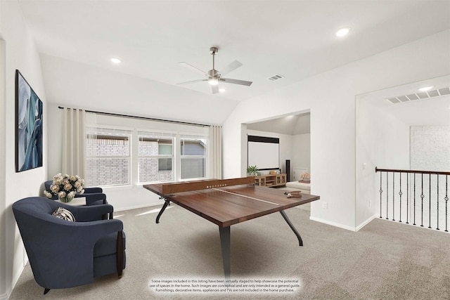 game room with ceiling fan, lofted ceiling, and carpet flooring