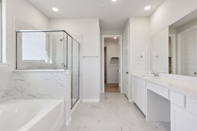 bathroom featuring vanity and shower with separate bathtub