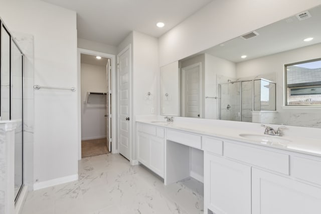 bathroom featuring vanity and an enclosed shower