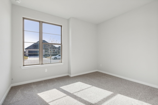 spare room featuring carpet floors