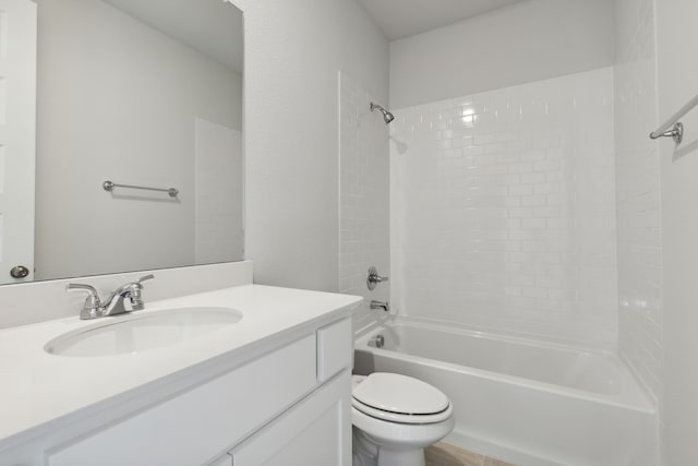 full bathroom featuring vanity, tiled shower / bath combo, and toilet