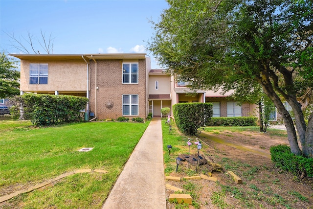 view of front of home with a front lawn