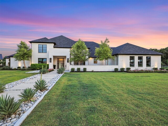 view of front of home with a yard